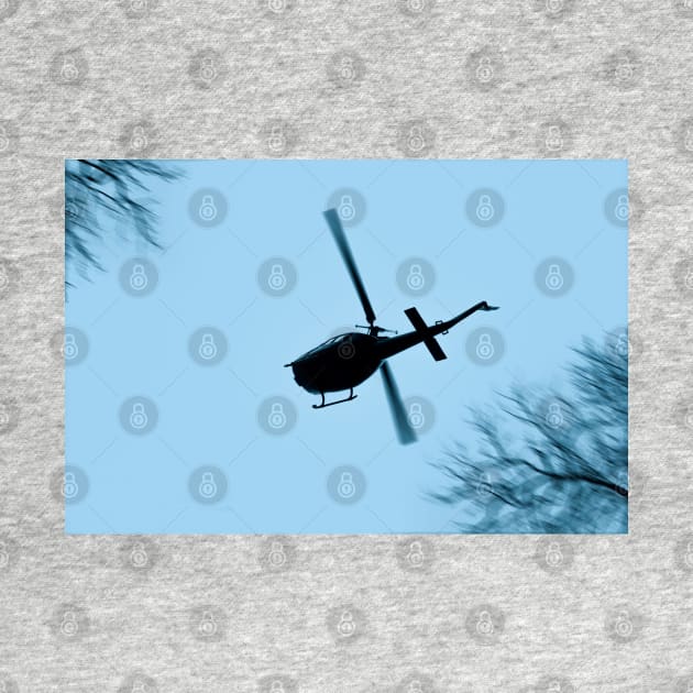 A Bell UH-1 Huey Iroquois flying low over trees by Pitmatic